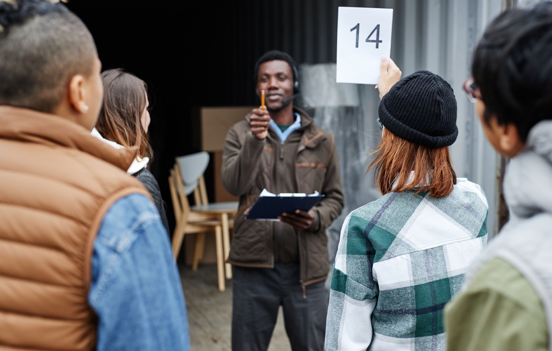 People at an auction in a storage unit