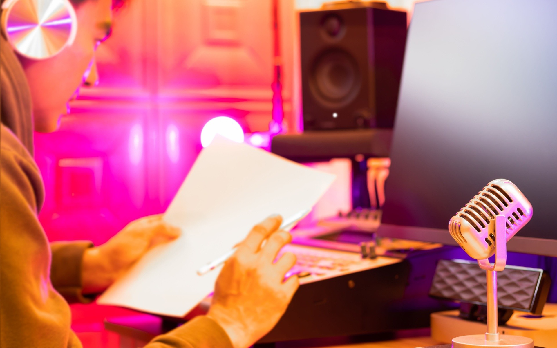 A man using equipment to record voice overs