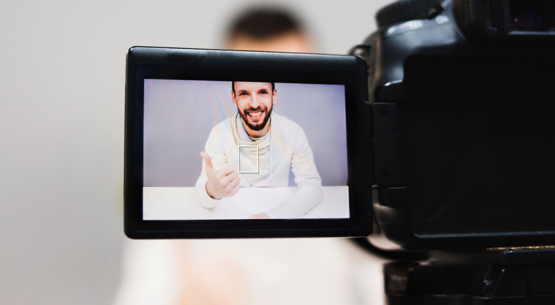 Man recording himself filming an online course 