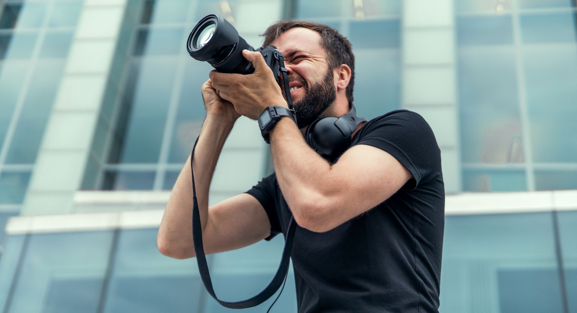 Man with a beard doing freelance photography.