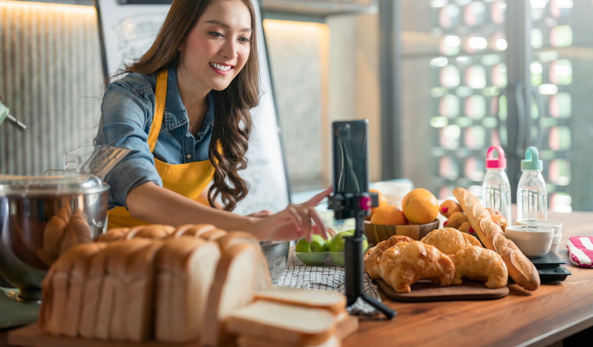 Woman recording herself doing cooking lessons to make money online