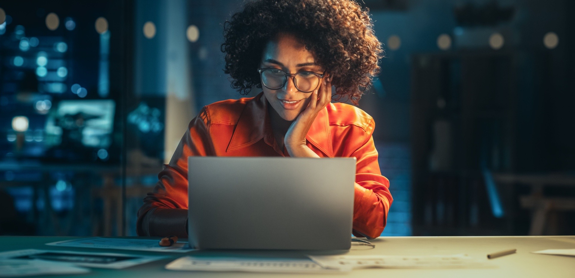 Woman writing creatively on a laptop 