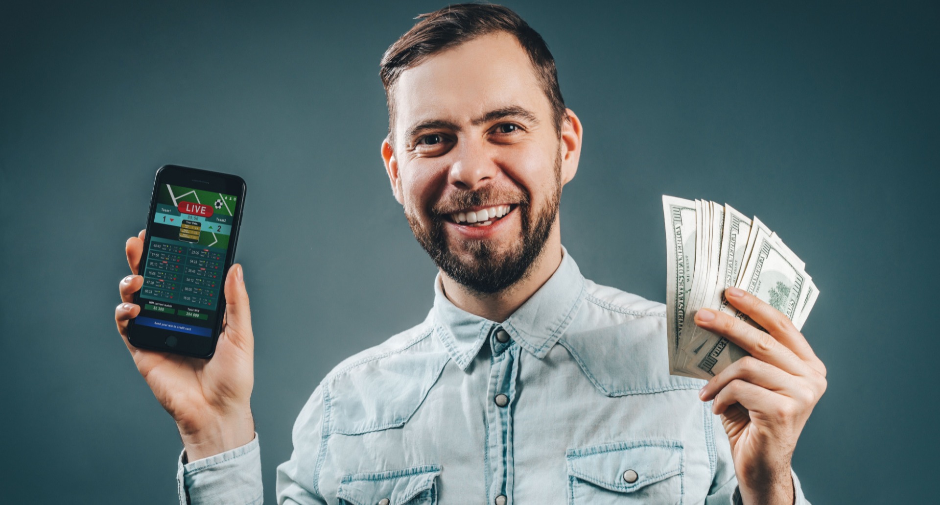 Man smiling after having made money from matched betting