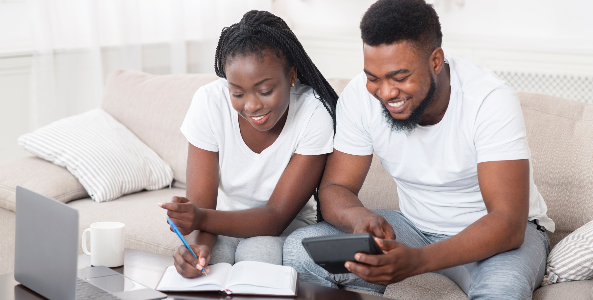 African American couple using matched betting calculator