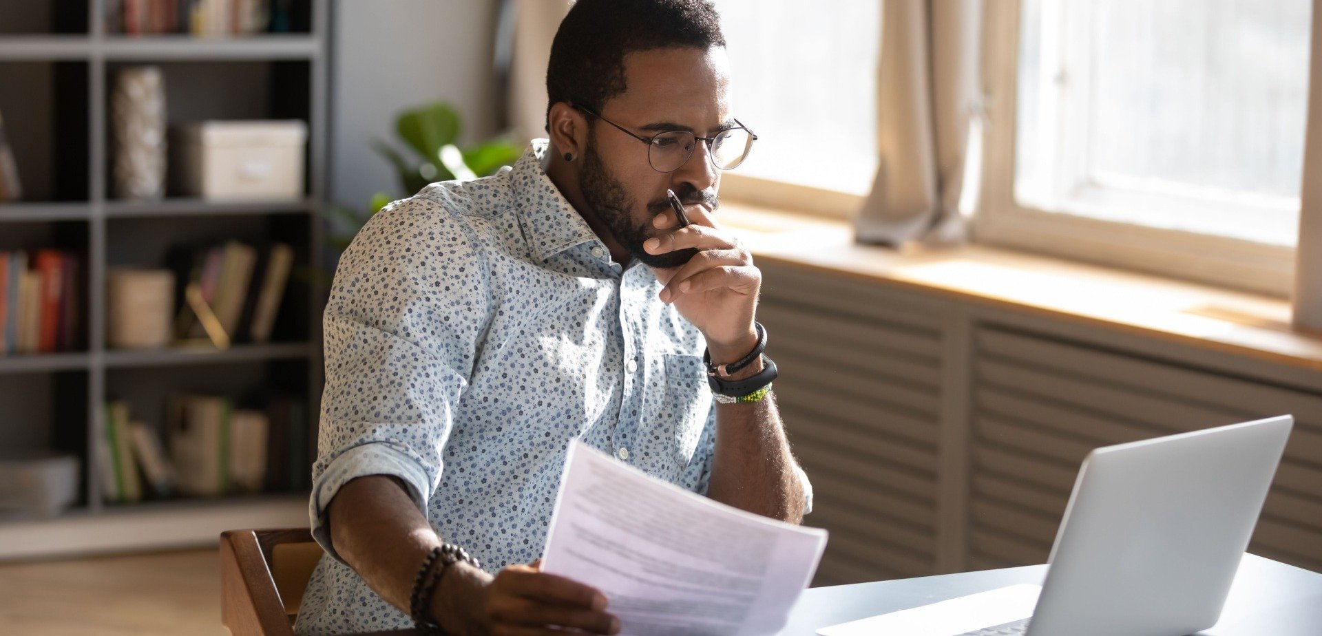 African American man checking taxes on matched betting account