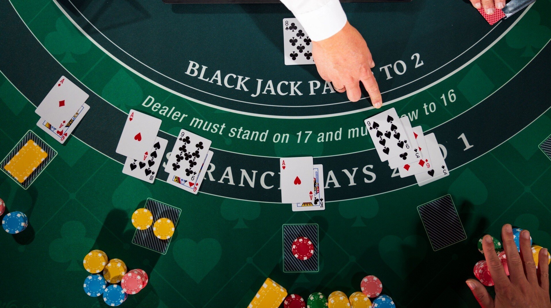 A blackjack table with 4 players playing blackjack