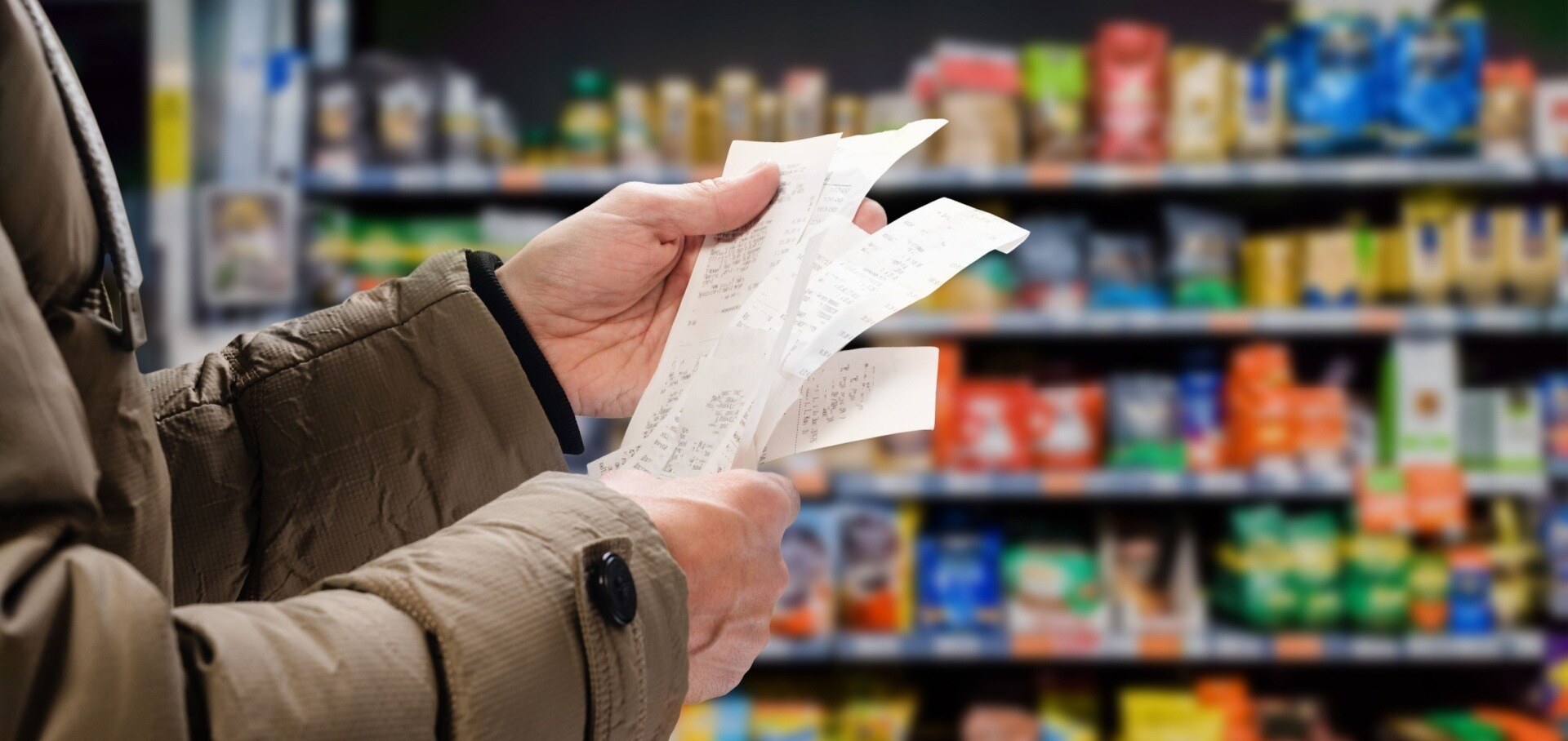 Woman holding receipts in a store