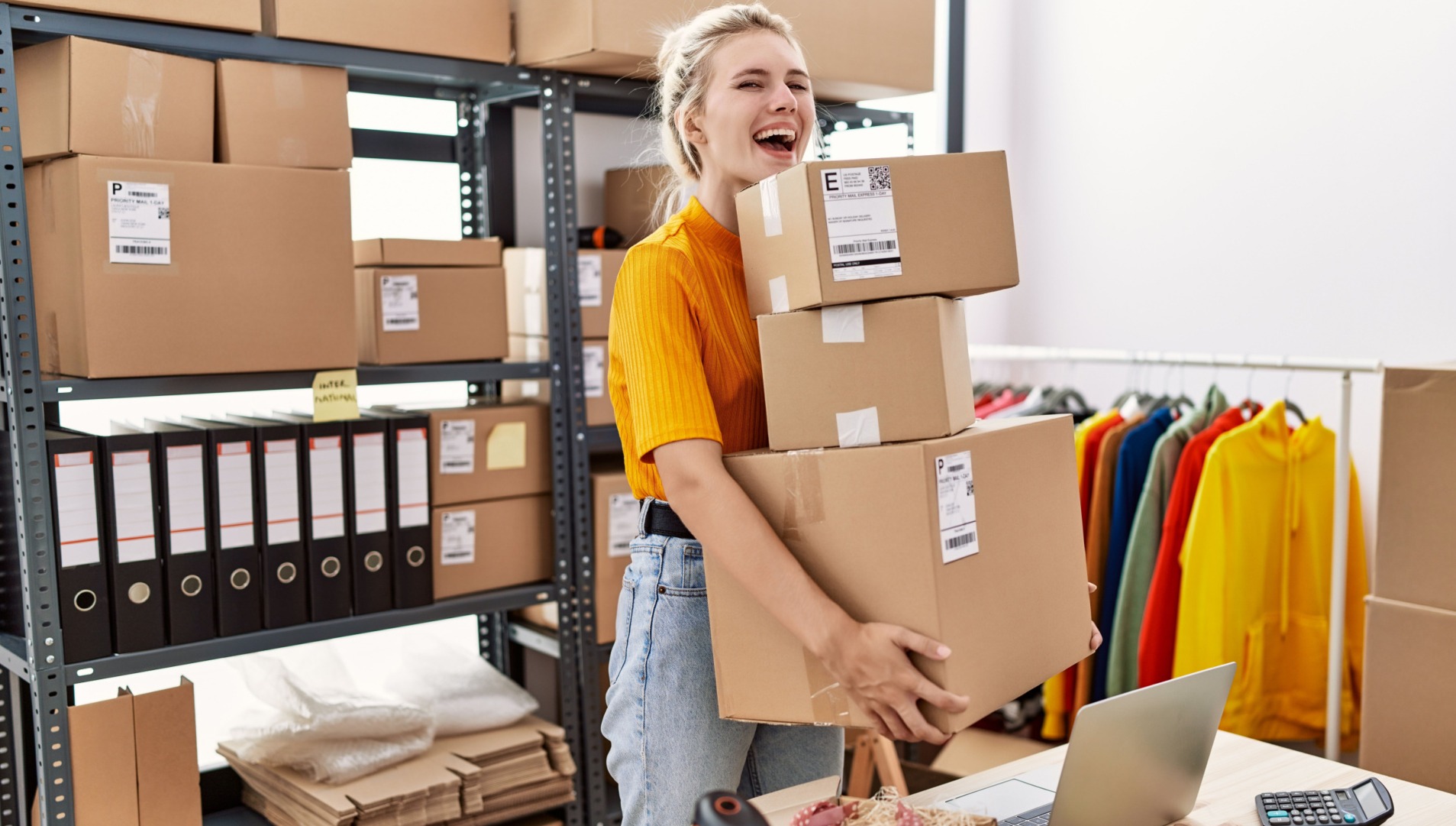 Ecommerce saleswoman about to post a shipment of clothes