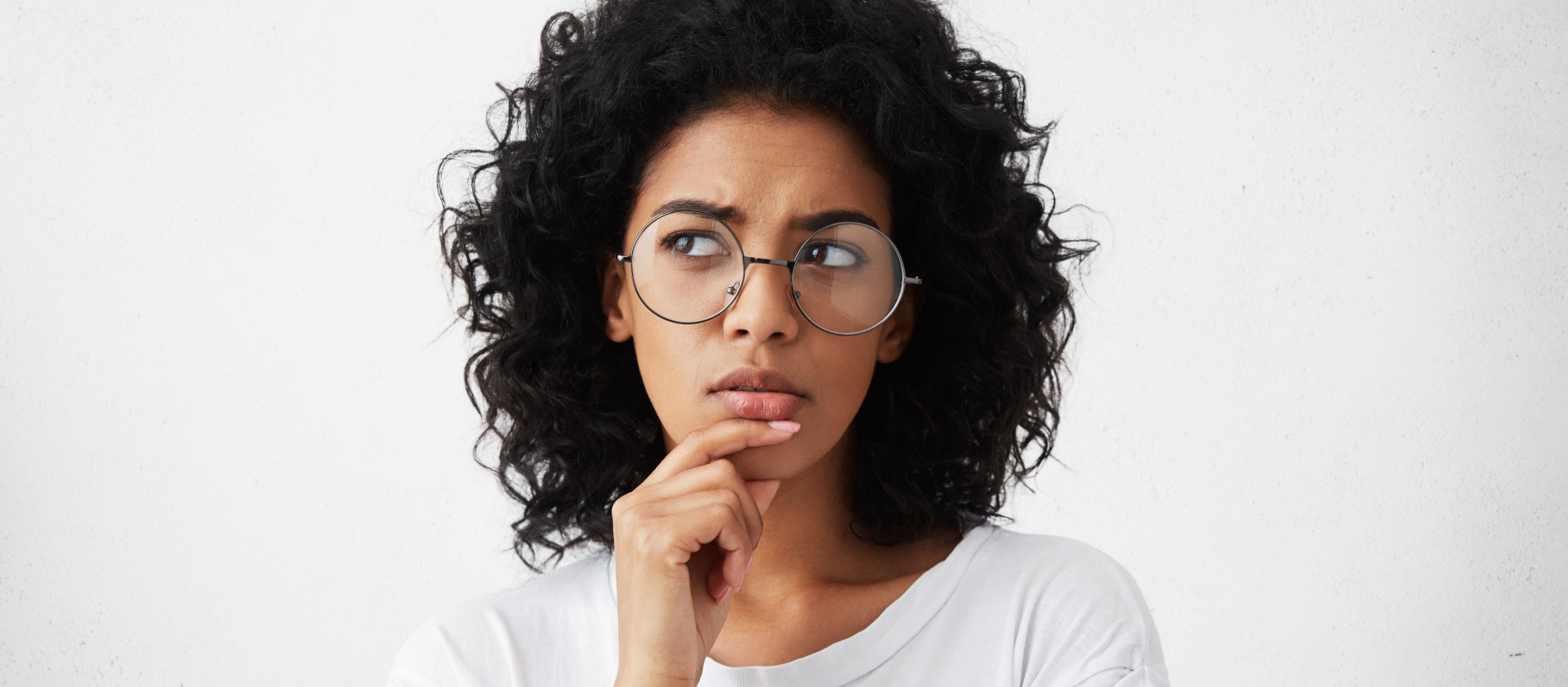 African American lady thinking looking upwards