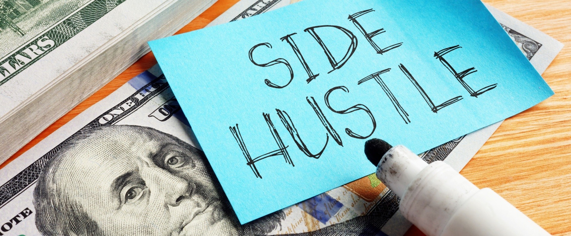 Side hustle graphic written on a post it note