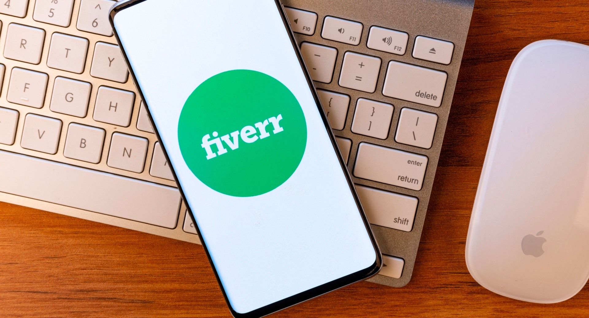 Phone on top of a laptop with the app fiverr open 