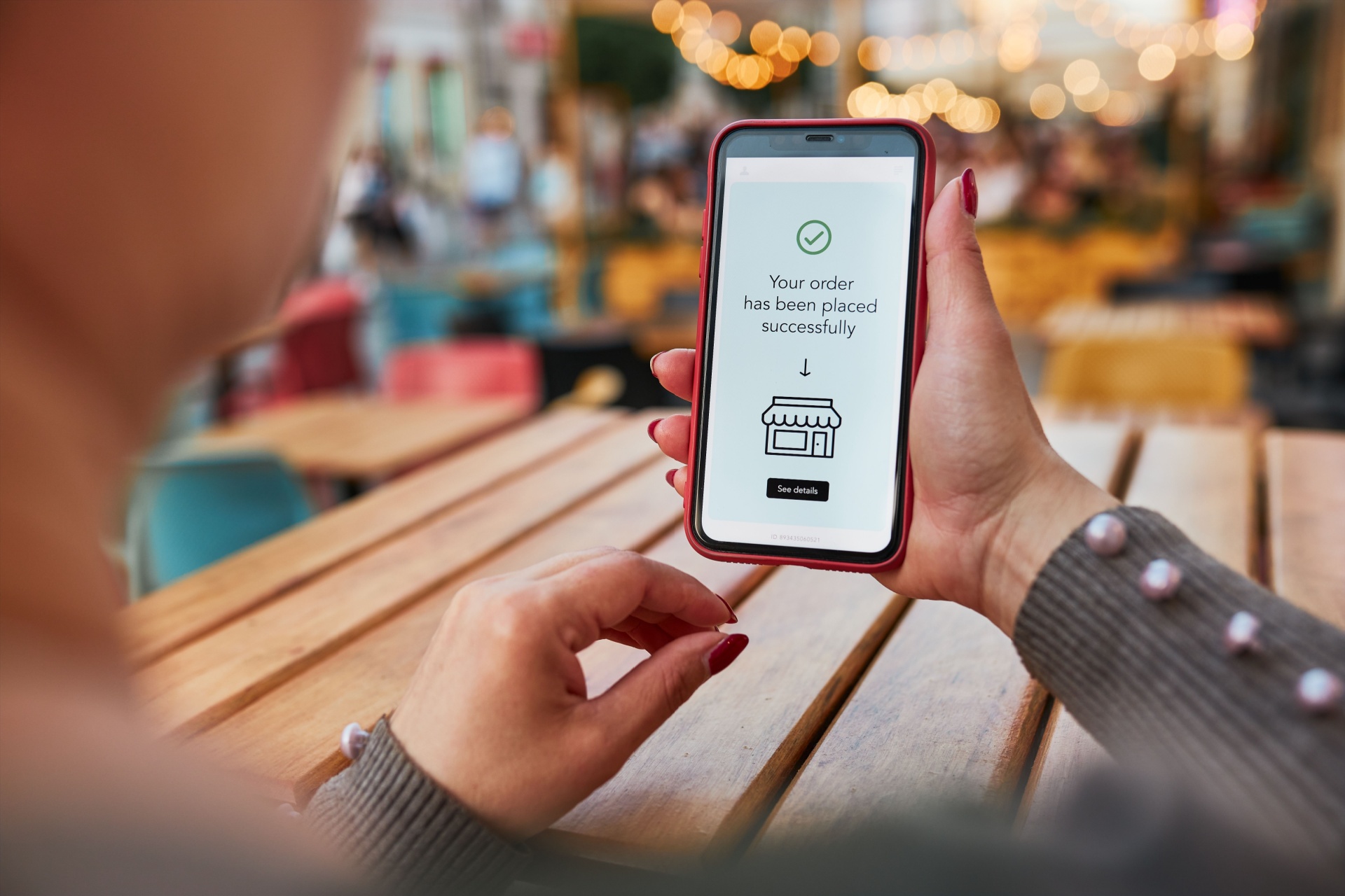 person holding smartphone selling digital products