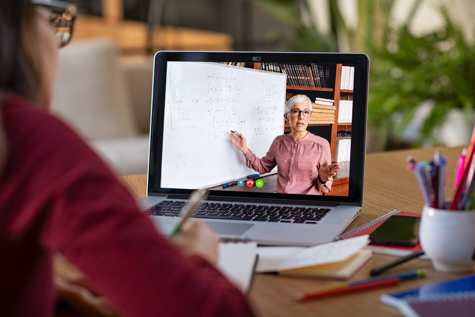 Woman doing an online course from a laptop screen