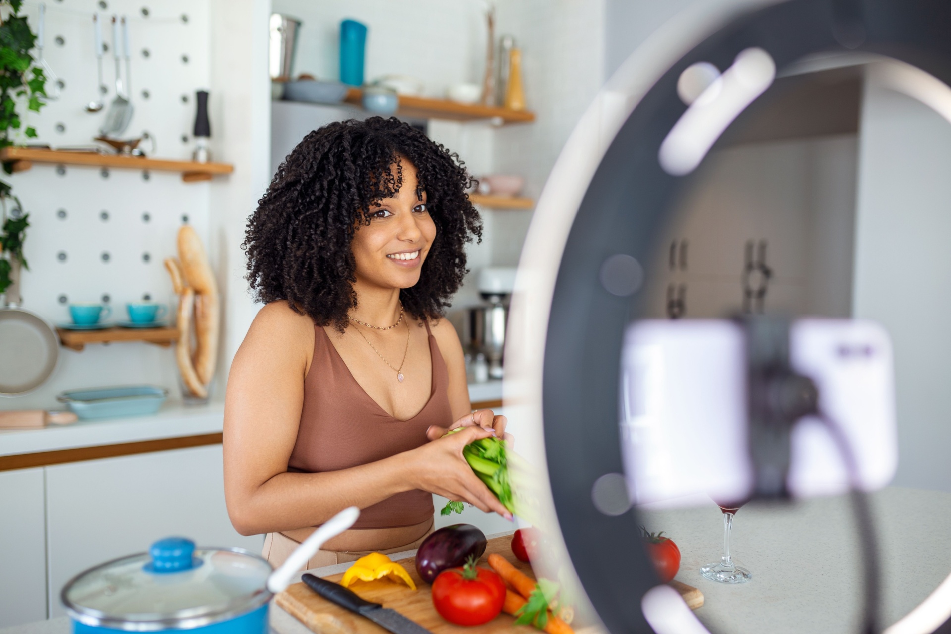 Woman sat down working with a camera on she might be an influencer 